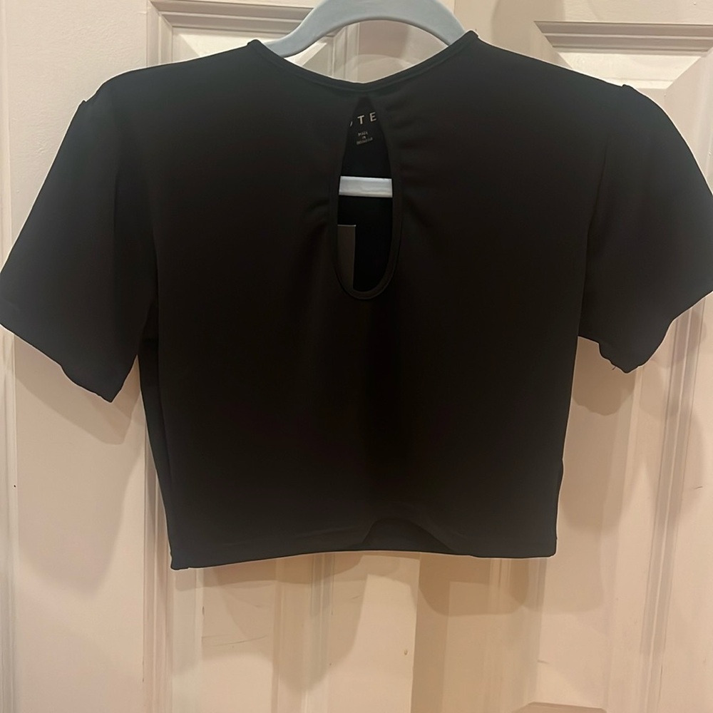 Boutique black crop top shirt with peep hole